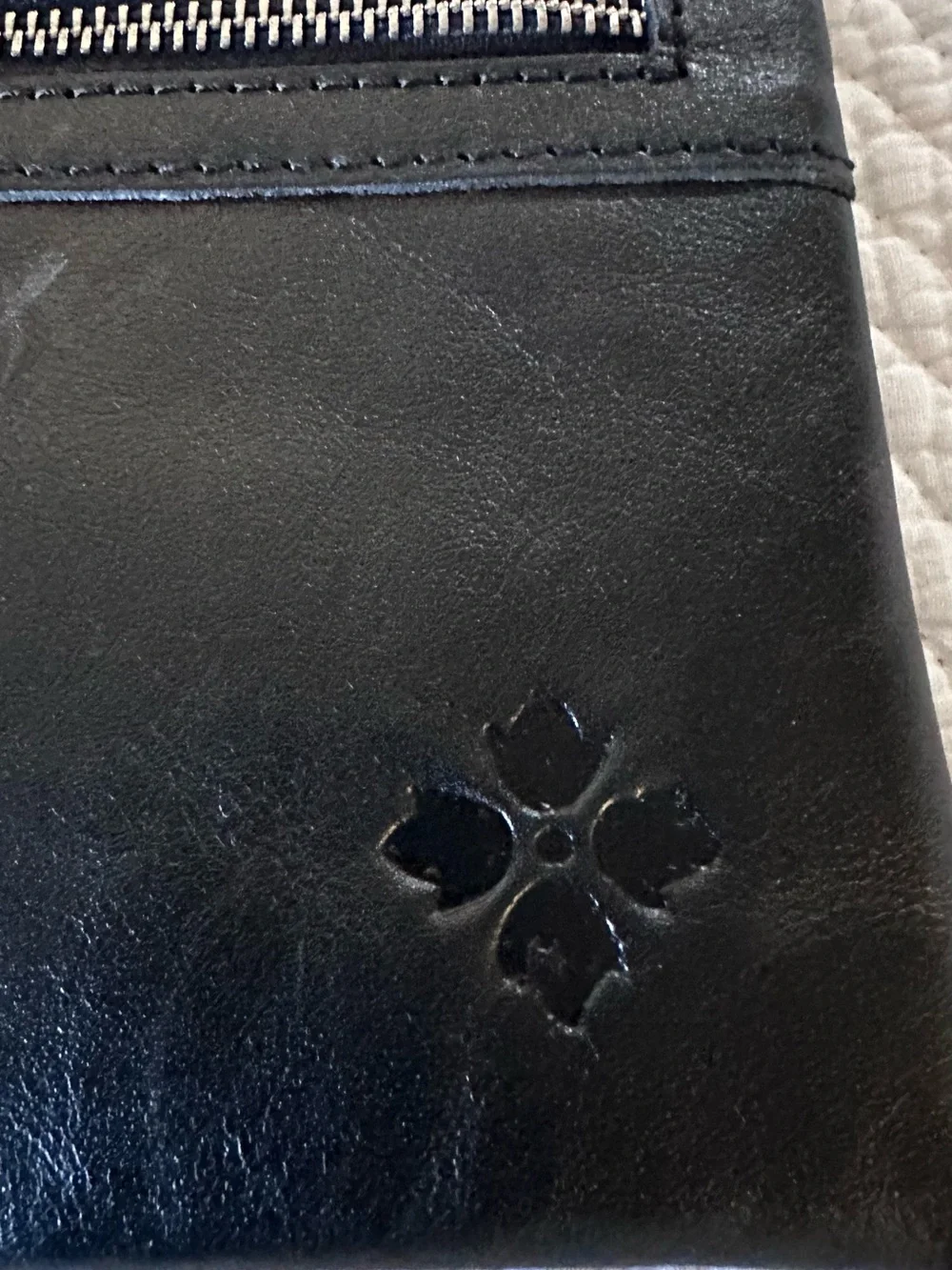 Patricia Nash Black Leather clutches with Embossed Clover Motif